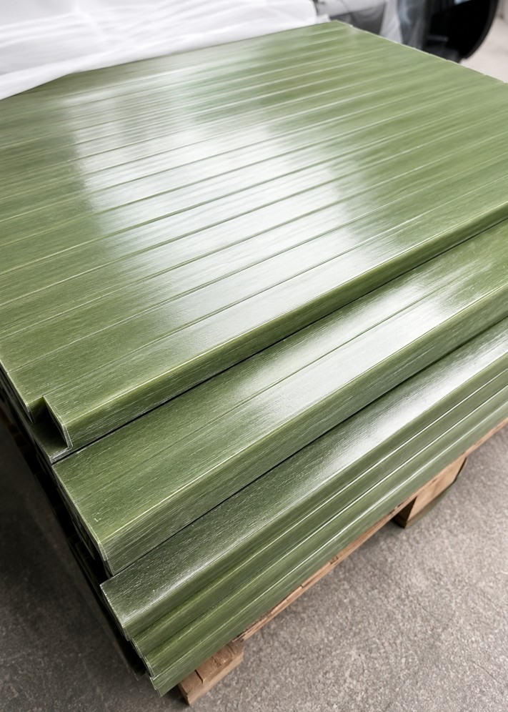 Green epoxy insulation pultruded rods and profiles stacked on pallet