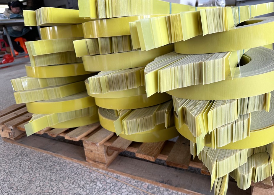 Stacked yellow epoxy laminate sheets